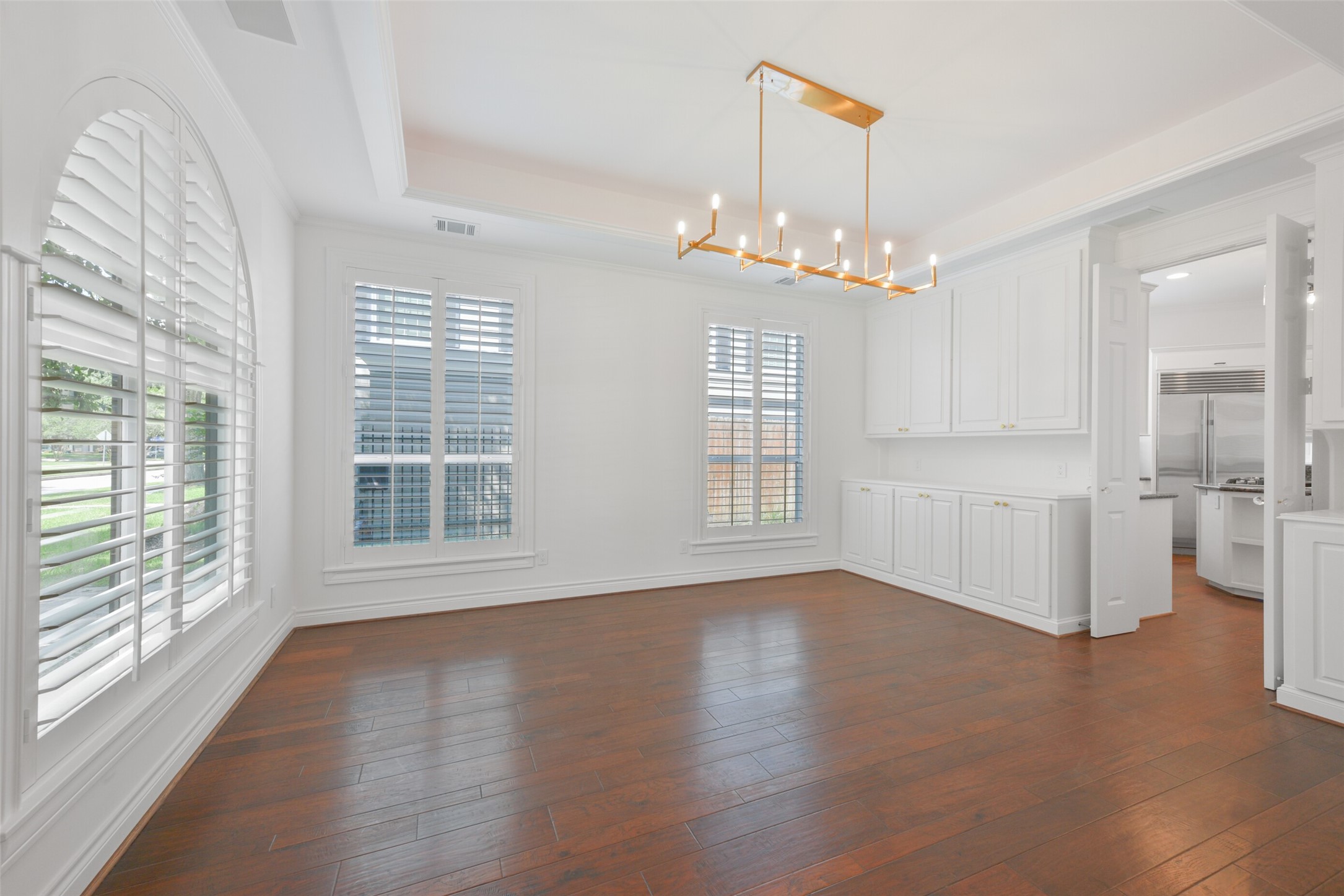 3724 Wroxton Road Houston, TX 77005 - Photo 9 of 40 The dining room also has built-in storage and buffets on either side of the double doors leading to the kitchen.