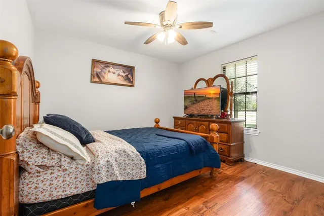 a bedroom with bed and window