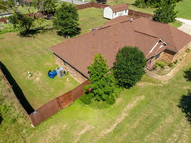 an aerial view of residential houses with outdoor space