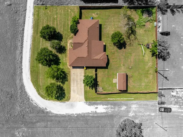 an aerial view of a house with a garden