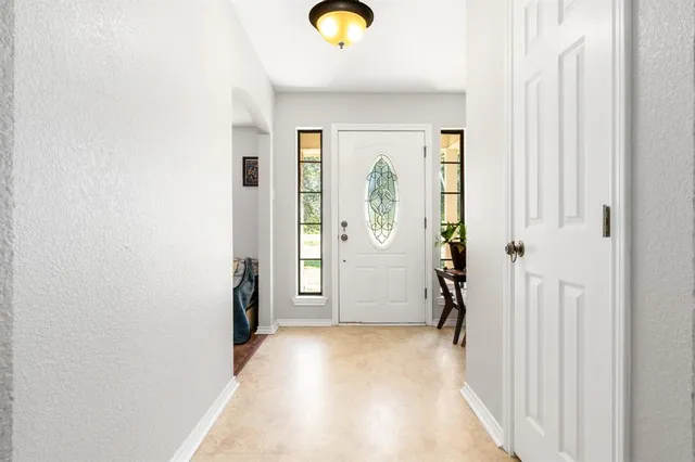 a view of entryway with wooden floor