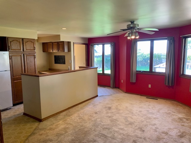 3272 River Road Kankakee, IL 60901 - Photo 3 of 15 a view of kitchen with refrigerator microwave and stove