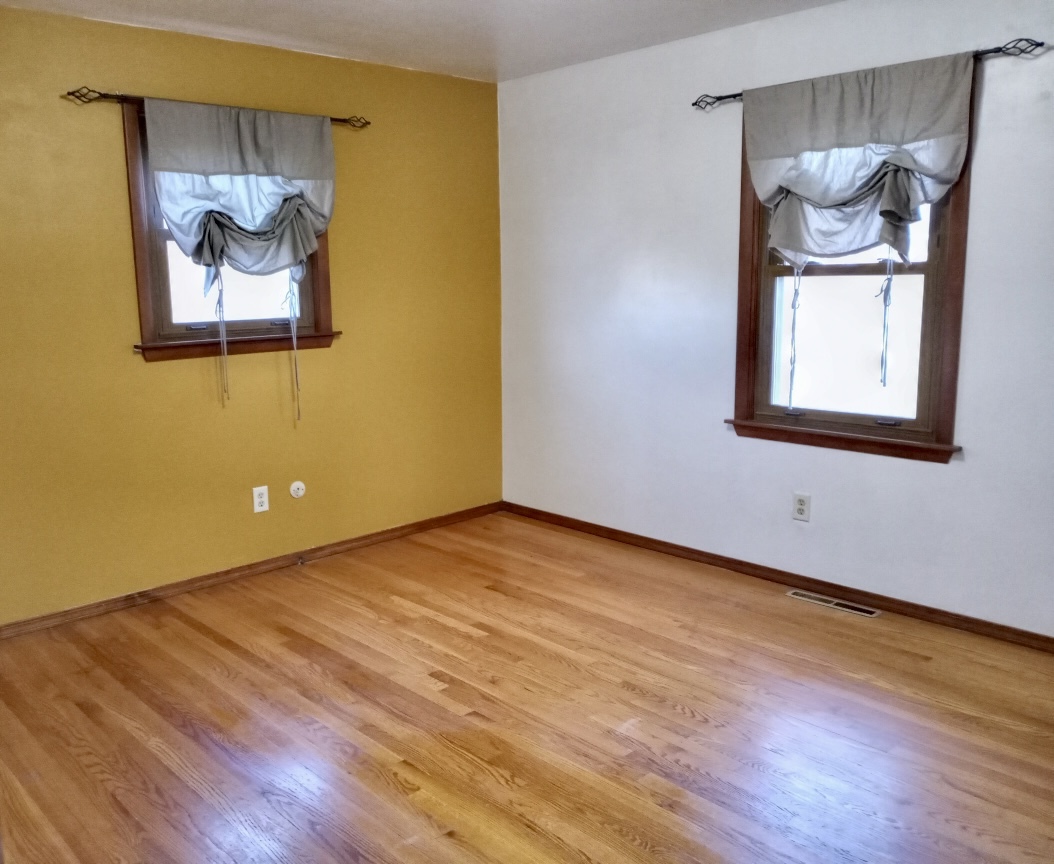 3272 River Road Kankakee, IL 60901 - Photo 8 of 15 a view of an empty room with wooden floor and a window