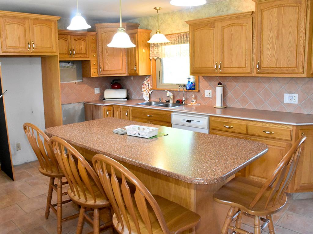 735 Gasteiger Road Meadville, PA 16335 - Photo 13 of 26 a kitchen with a table chairs sink and cabinets