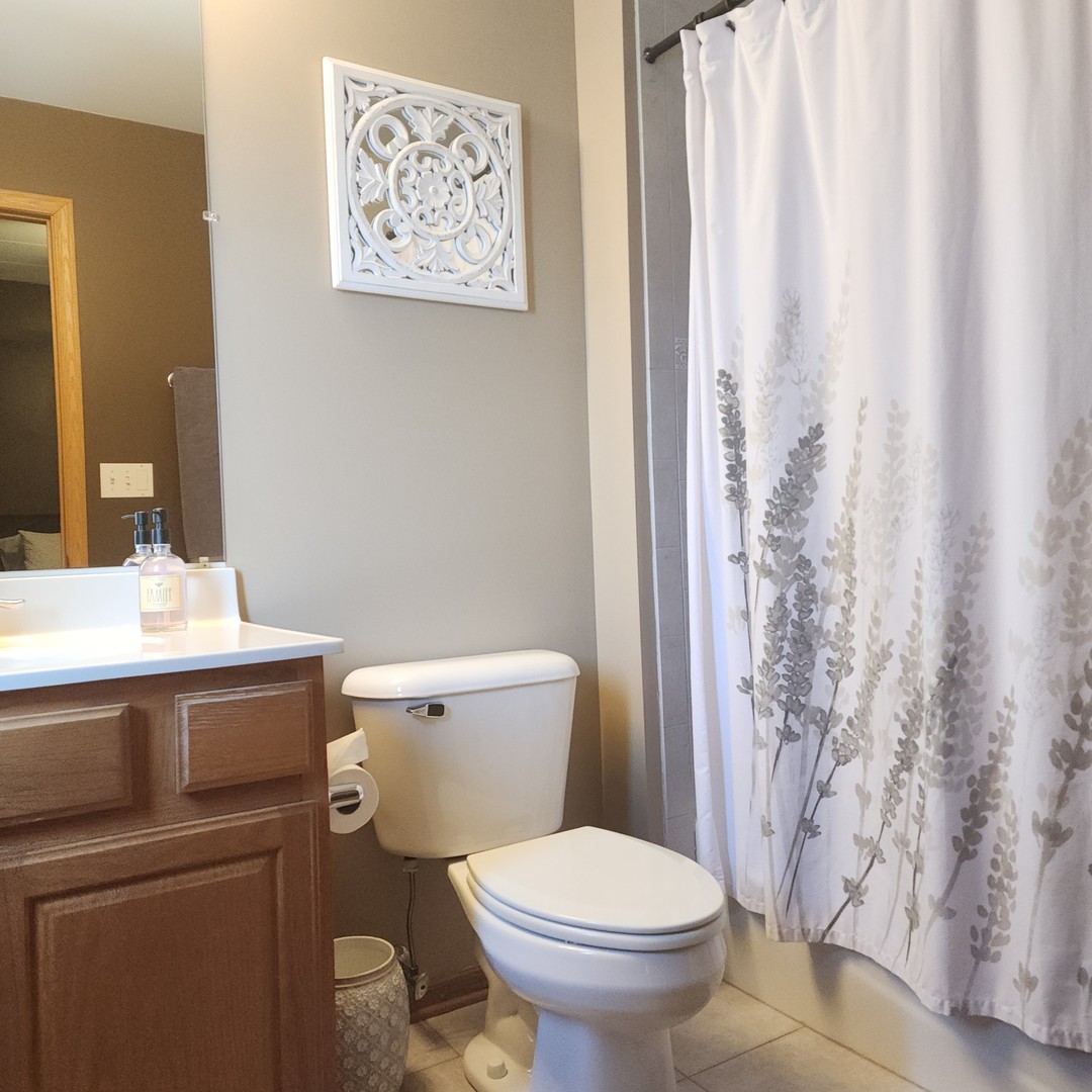 10624 Central Avenue, Unit 2B Chicago Ridge, IL 60415 - Photo 12 of 16 a bathroom with a toilet and a sink