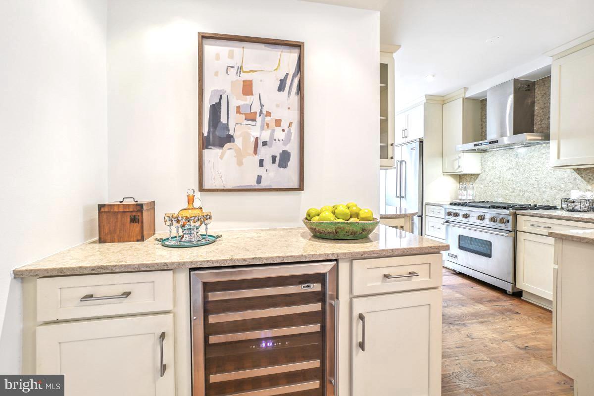 1910 Kalorama Road Northwest, Unit 403 Washington, DC 20009 - Photo 11 of 52 a kitchen with stainless steel appliances a stove a sink and cabinets