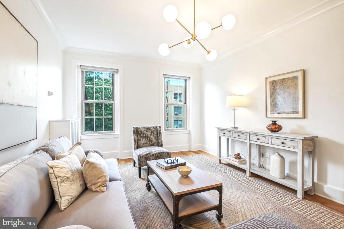 1910 Kalorama Road Northwest, Unit 403 Washington, DC 20009 - Photo 16 of 52 a living room with furniture and a table