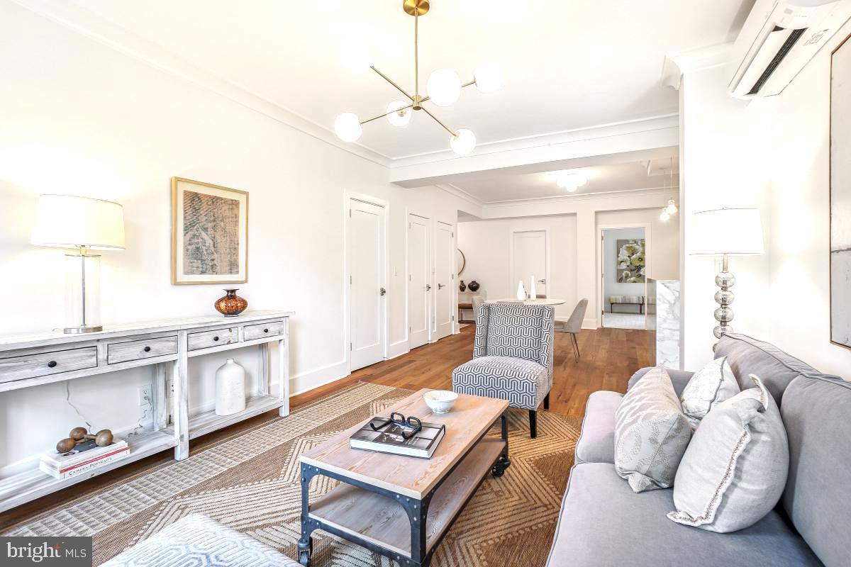 1910 Kalorama Road Northwest, Unit 403 Washington, DC 20009 - Photo 19 of 52 a living room with furniture and a table