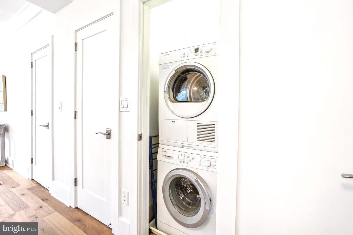 1910 Kalorama Road Northwest, Unit 403 Washington, DC 20009 - Photo 20 of 52 a view of a hallway with washer and dryer