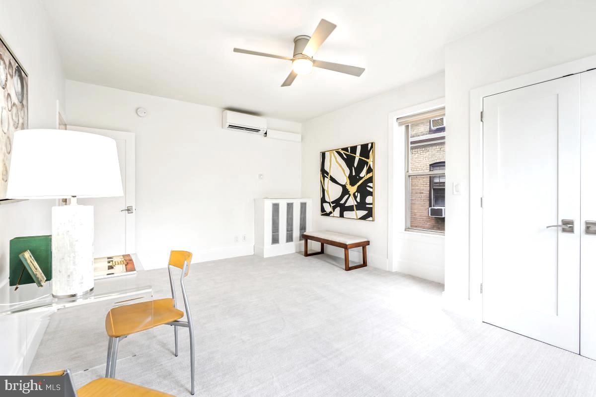 1910 Kalorama Road Northwest, Unit 403 Washington, DC 20009 - Photo 23 of 52 a living room with furniture and a table