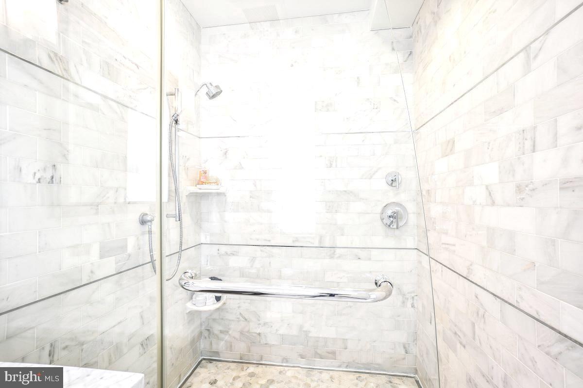 1910 Kalorama Road Northwest, Unit 403 Washington, DC 20009 - Photo 29 of 52 a bathroom with a bathtub and shower