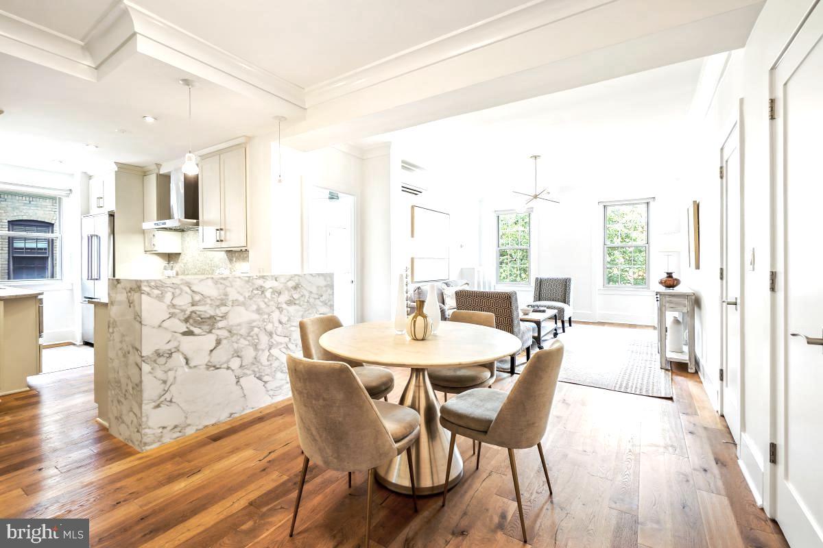 1910 Kalorama Road Northwest, Unit 403 Washington, DC 20009 - Photo 8 of 52 a view of a dining room with furniture and wooden floor