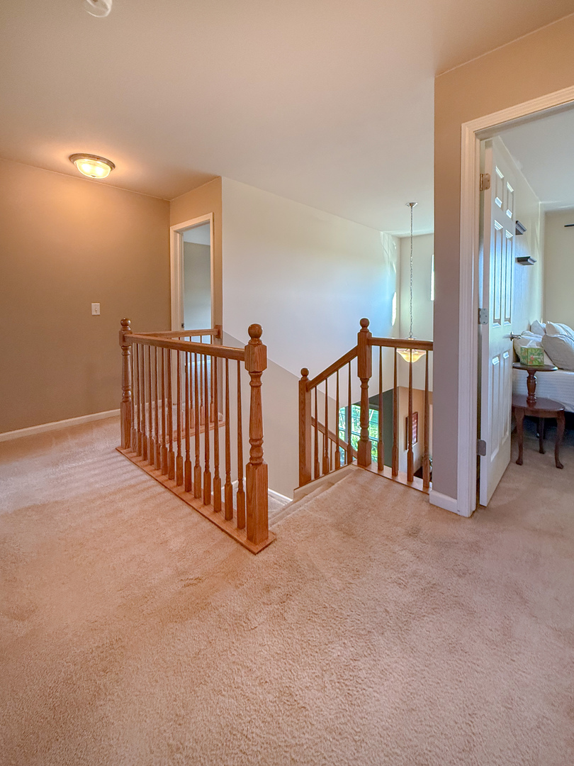 445 East Becker Place Sycamore, IL 60178 - Photo 16 of 27 a view of a hall with a staircase