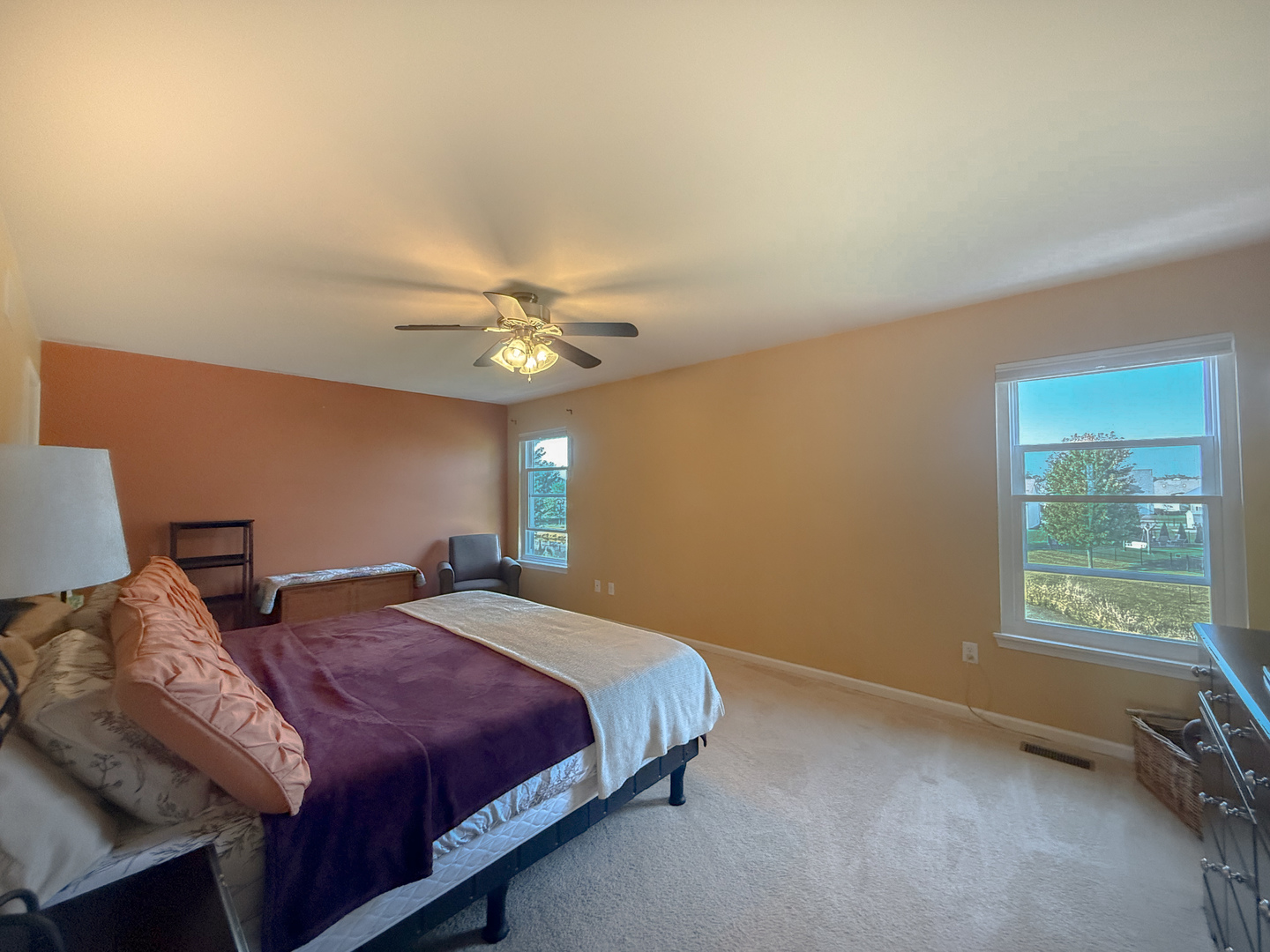 445 East Becker Place Sycamore, IL 60178 - Photo 21 of 27 a bedroom with a bed a chandelier and a window