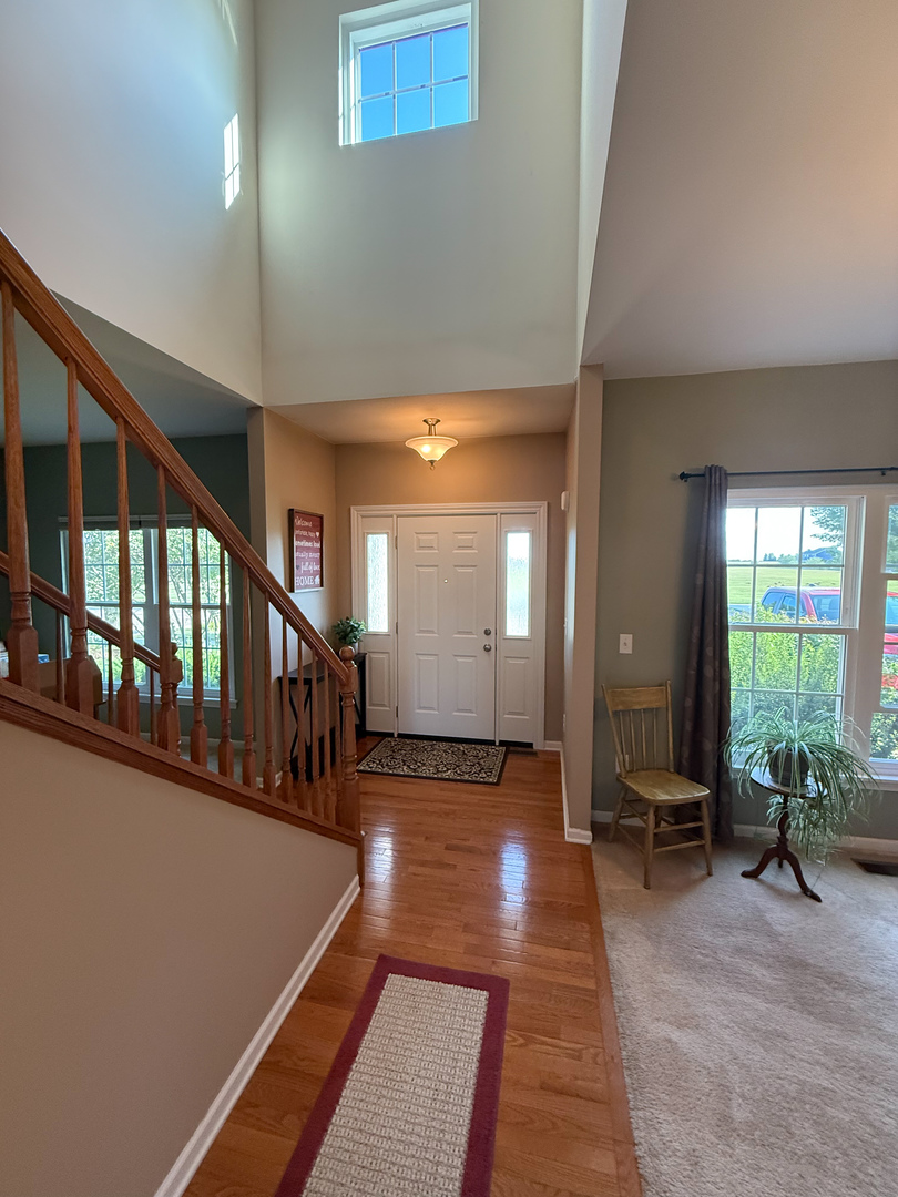 445 East Becker Place Sycamore, IL 60178 - Photo 3 of 27 a view of a room with wooden floor