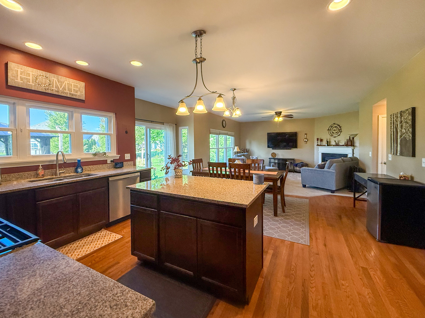 445 East Becker Place Sycamore, IL 60178 - Photo 9 of 27 a kitchen with a sink cabinets and wooden floor
