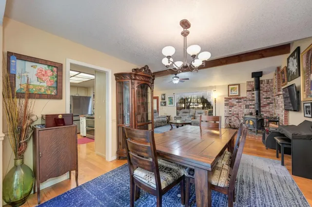 a kitchen with stainless steel appliances a stove sink microwave and cabinets