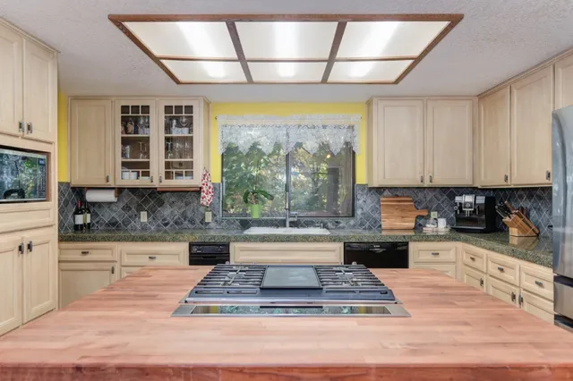 a utility room with sink dryer and washer