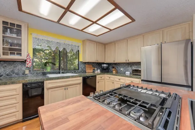 a utility room with sink dryer and washer