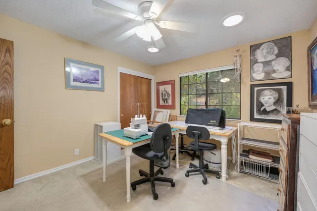a view of a patio with table and chairs with wooden floor and fence