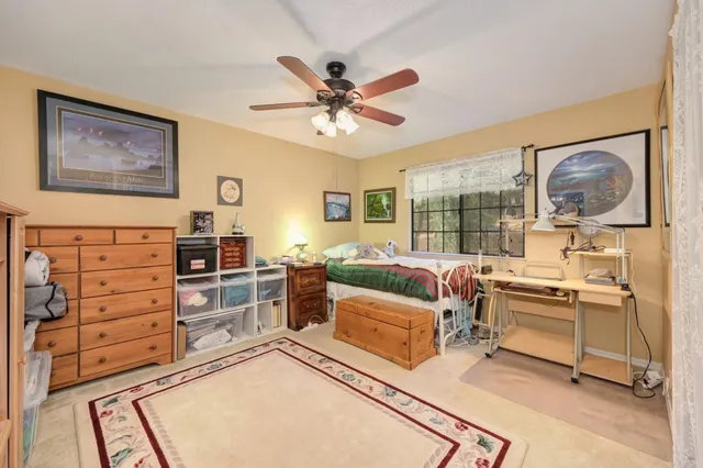 a view of a chairs and table on the wooden floor