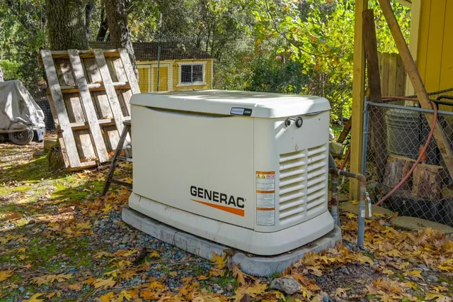 a view of a patio with table and chairs with wooden floor and fence