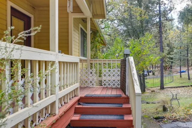 a view of deck with wooden floor and a potted plant