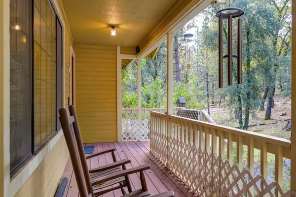 a view of a balcony with furniture