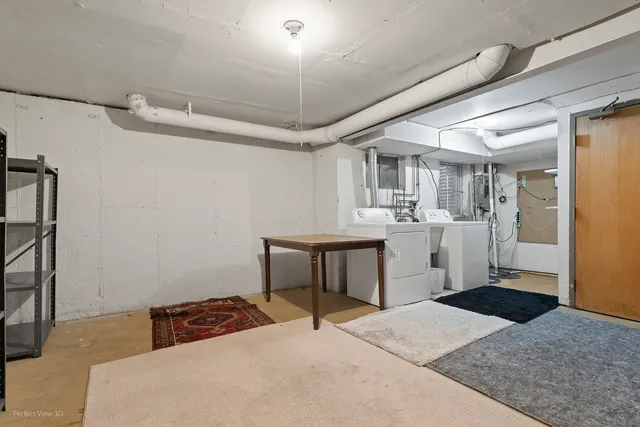 a bedroom with a bed and a desk