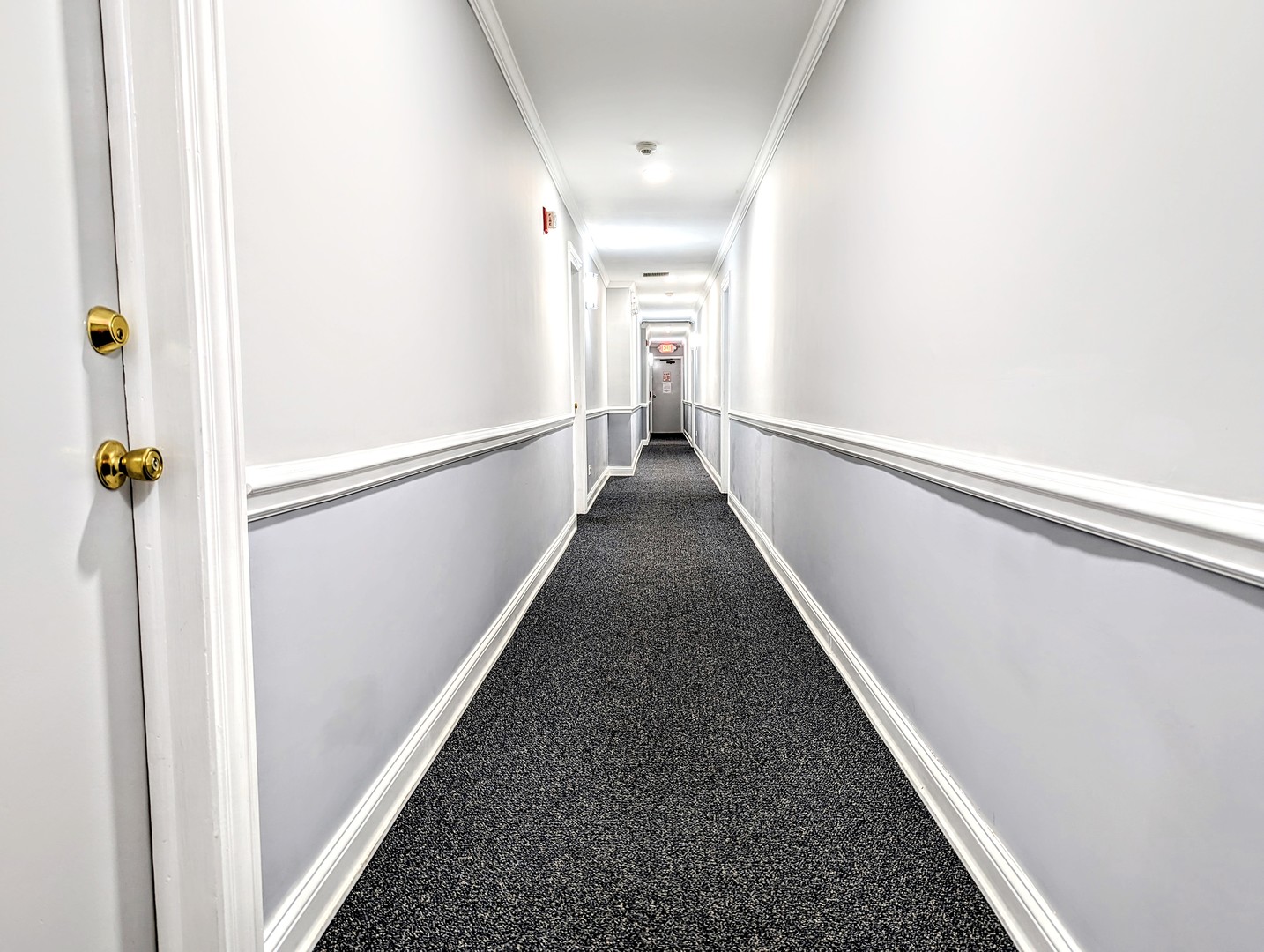 9418 Dee Road, Unit 203C Des Plaines, IL 60016 - Photo 18 of 24 a view of a hallway with wooden floor and staircase
