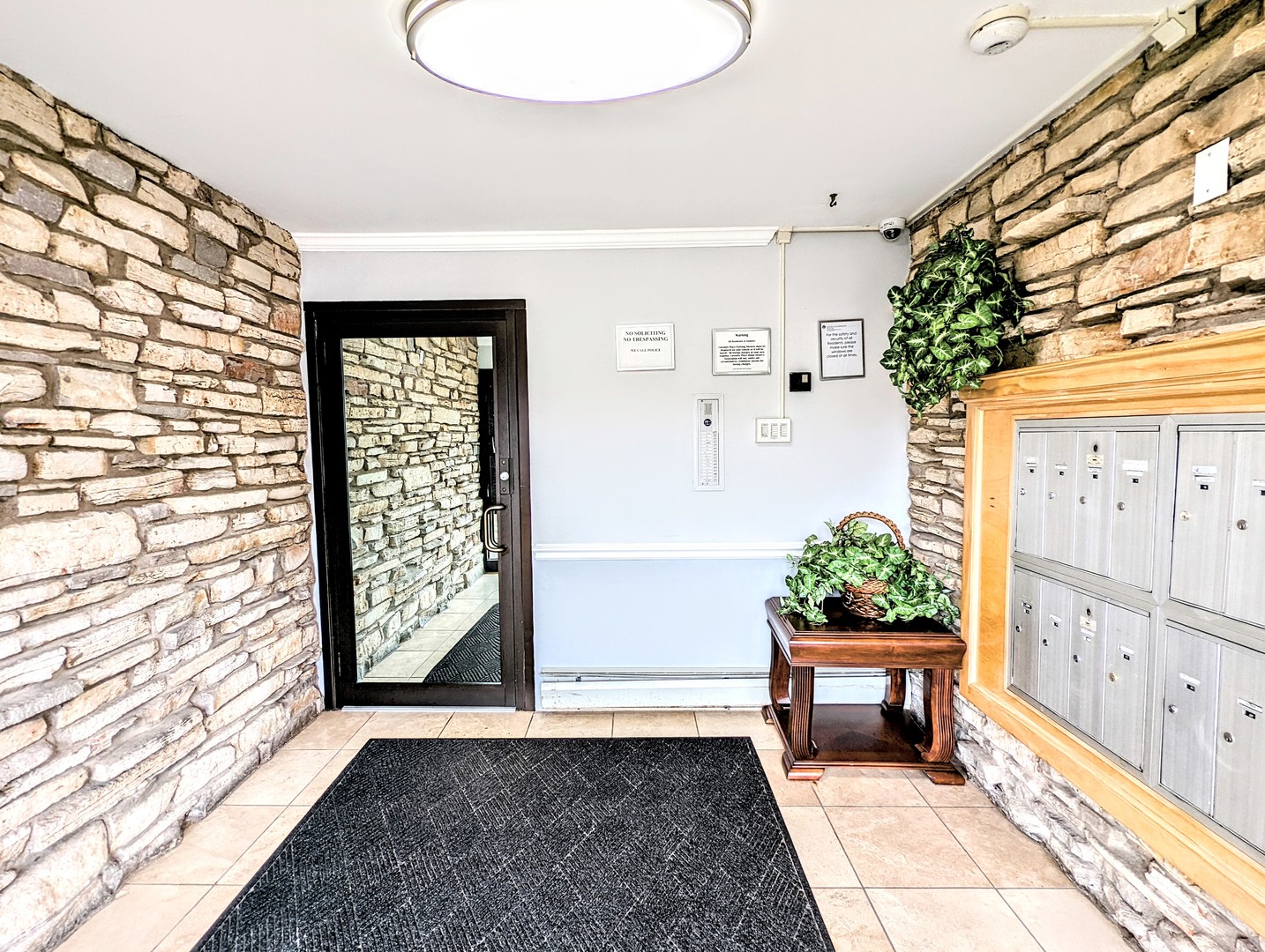 9418 Dee Road, Unit 203C Des Plaines, IL 60016 - Photo 2 of 24 a view of an entryway with wooden floor