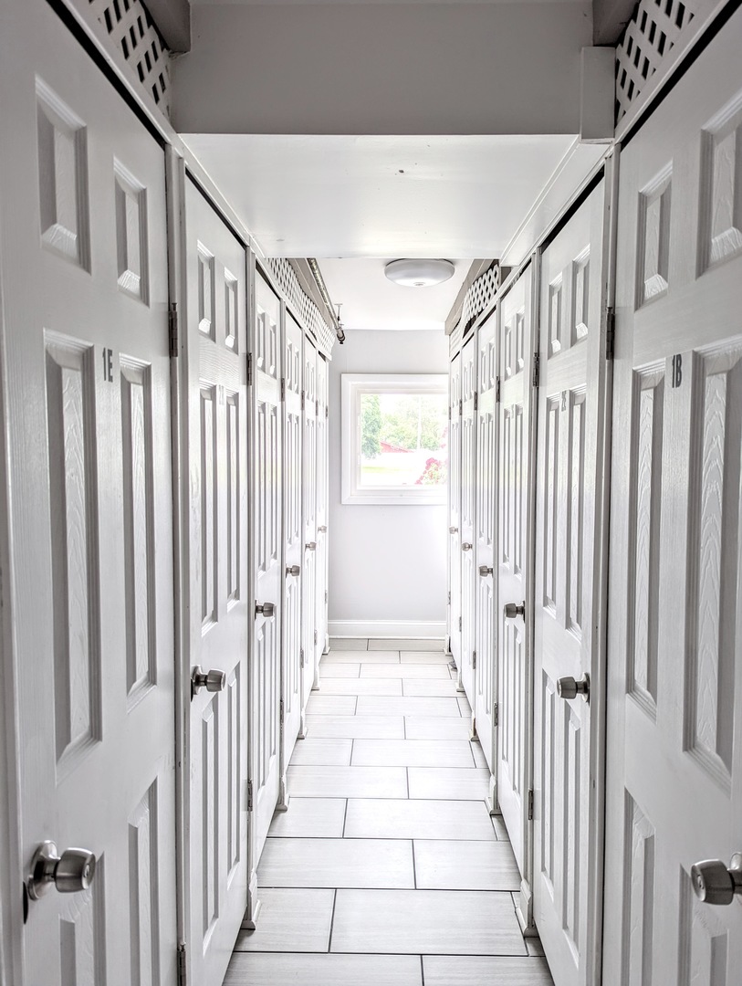 9418 Dee Road, Unit 203C Des Plaines, IL 60016 - Photo 21 of 24 a view of a hallway with a window