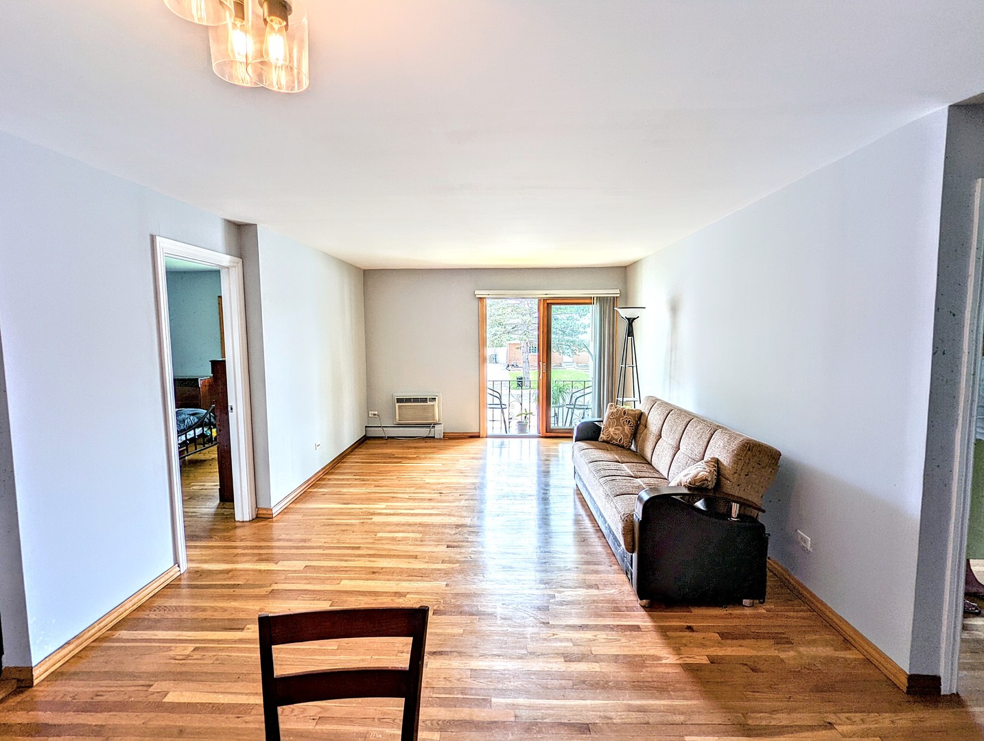 9418 Dee Road, Unit 203C Des Plaines, IL 60016 - Photo 6 of 24 a view of empty room with wooden floor