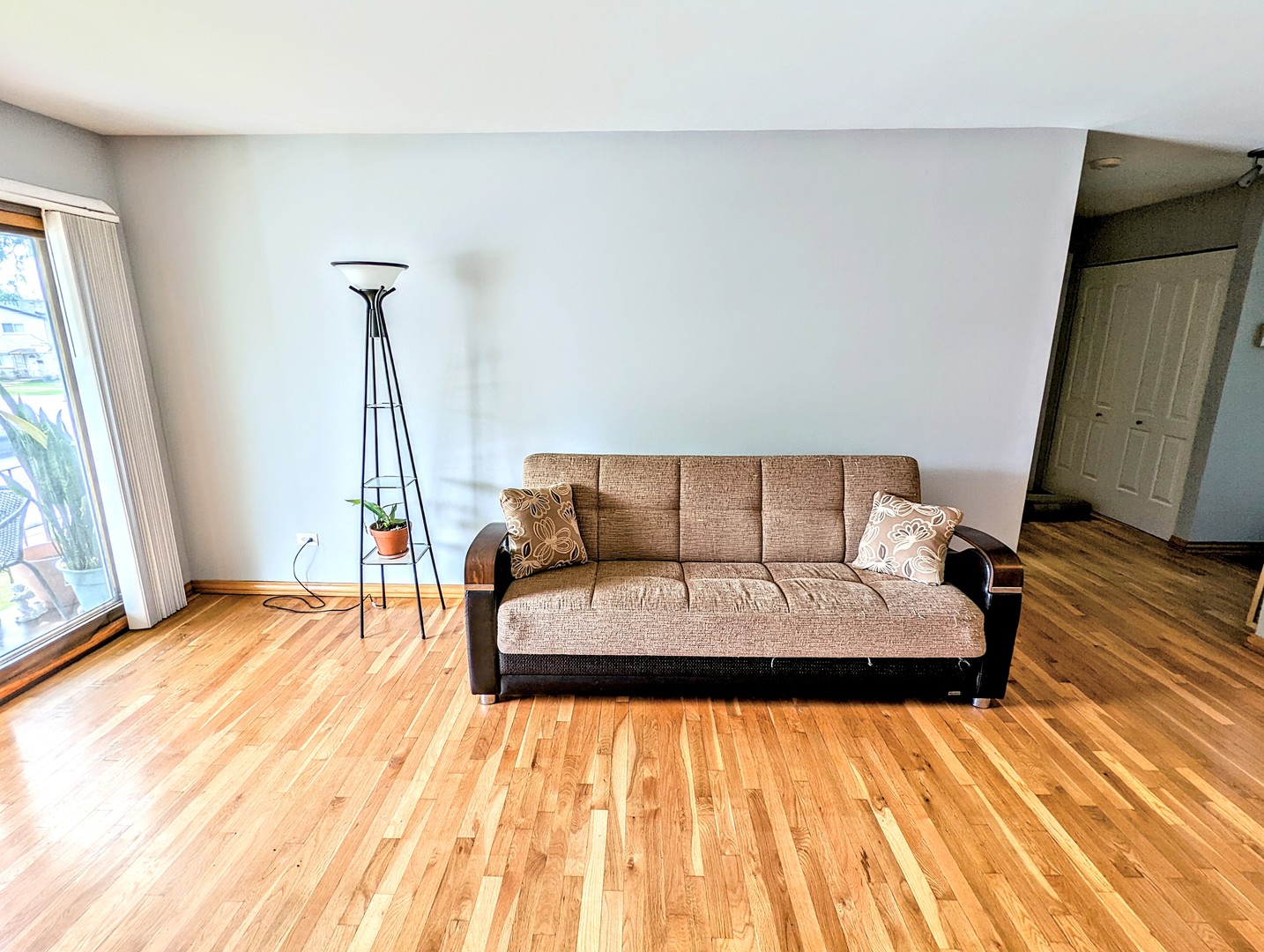 9418 Dee Road, Unit 203C Des Plaines, IL 60016 - Photo 9 of 24 a living room with a couch and a rug floor