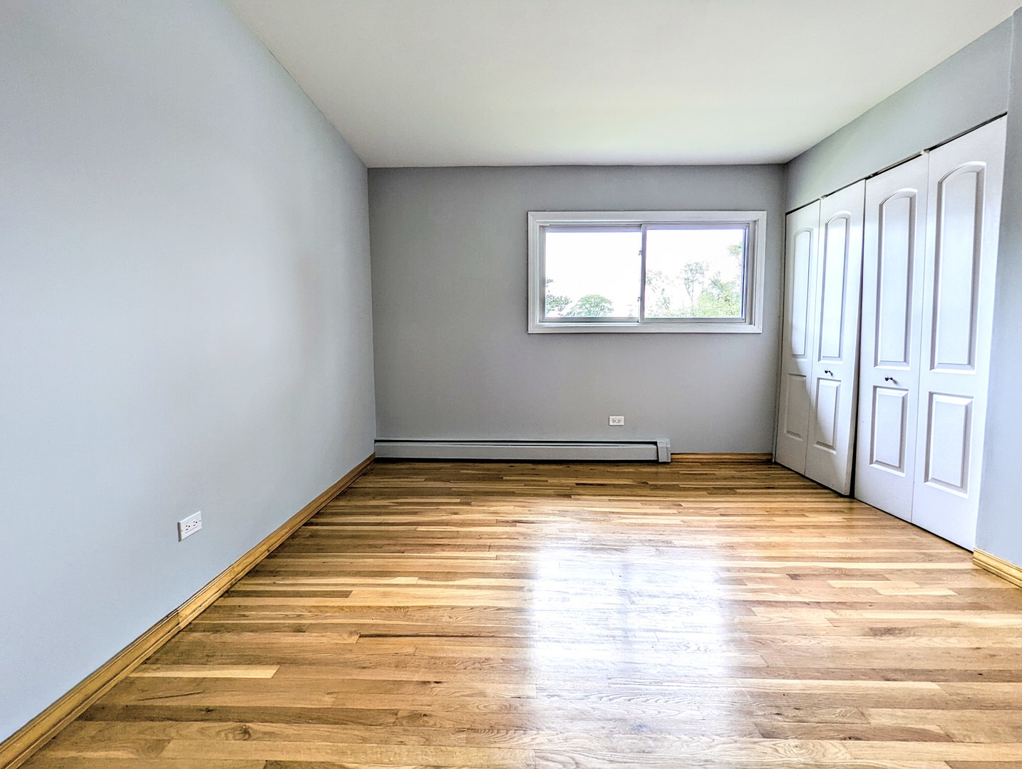 9418 Dee Road, Unit 203C Des Plaines, IL 60016 - Photo 10 of 24 a view of empty room with wooden floor and fan