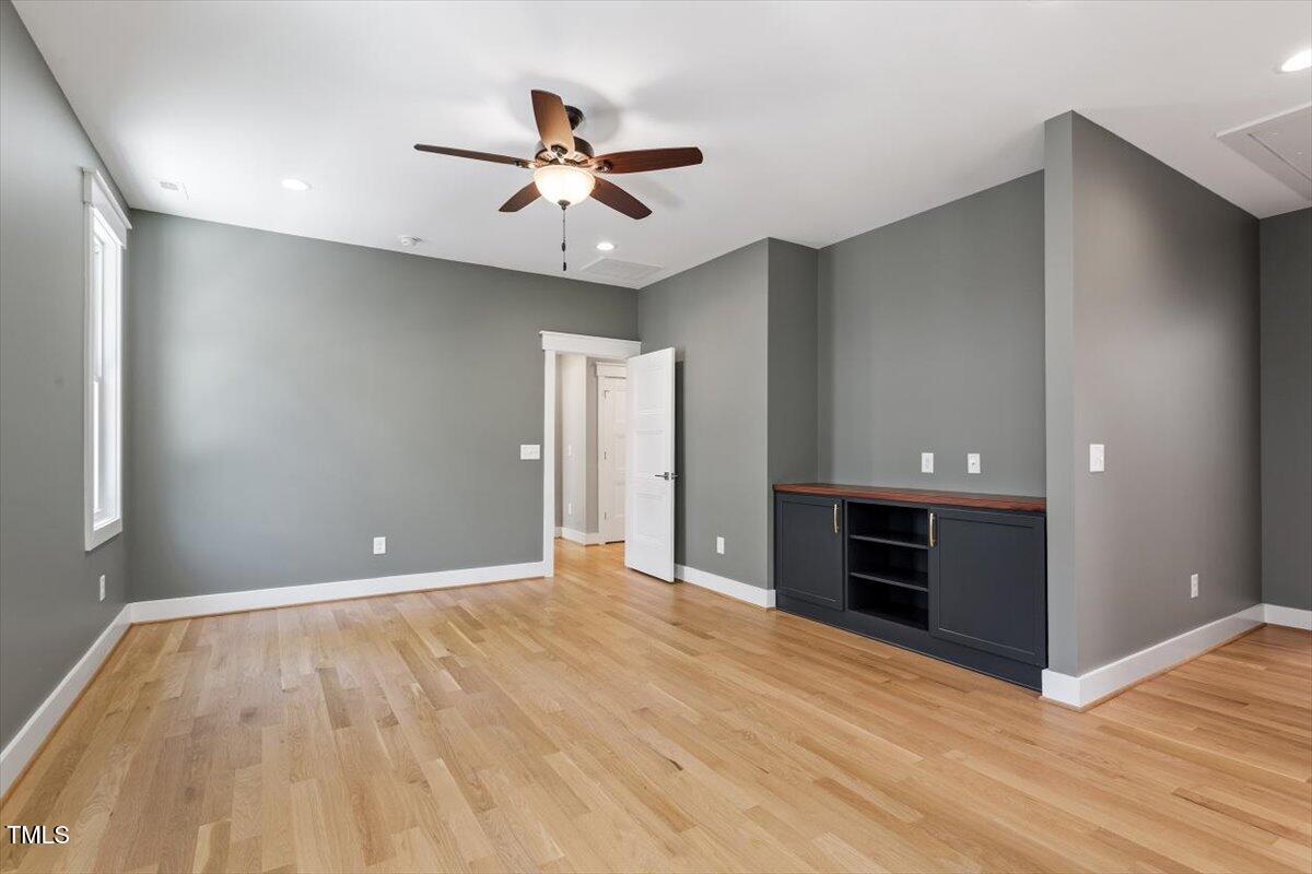 3934 Old Chapel Hill Road Durham, NC 27707 - Photo 28 of 47 a view of empty room with cabinet and ceiling fan