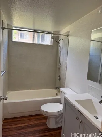 a bathroom with a sink a toilet and a bathtub