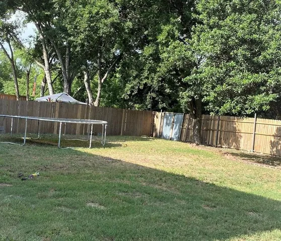 a view of a two chairs in the patio