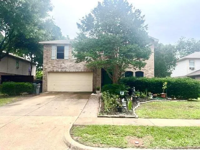 a house view with a garden space