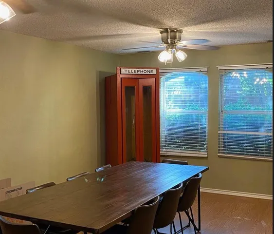 a workspace with furniture and window