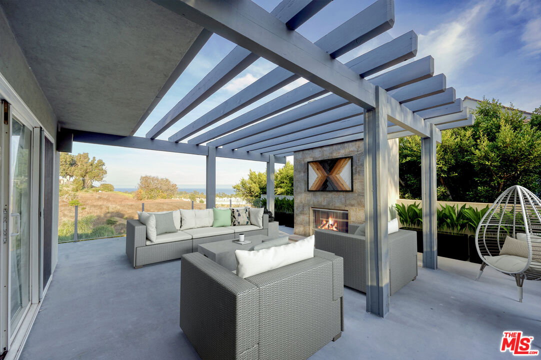 28907 Wight Road Malibu, CA 90265 - Photo 41 of 54 a view of living room kitchen with furniture and garden