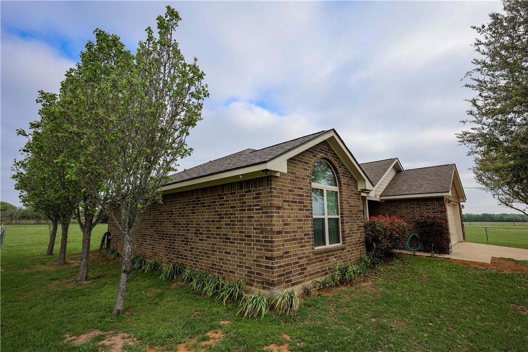 930 County Road 357 Gause, TX 77857 - Photo 11 of 17 a front view of a house with a garden