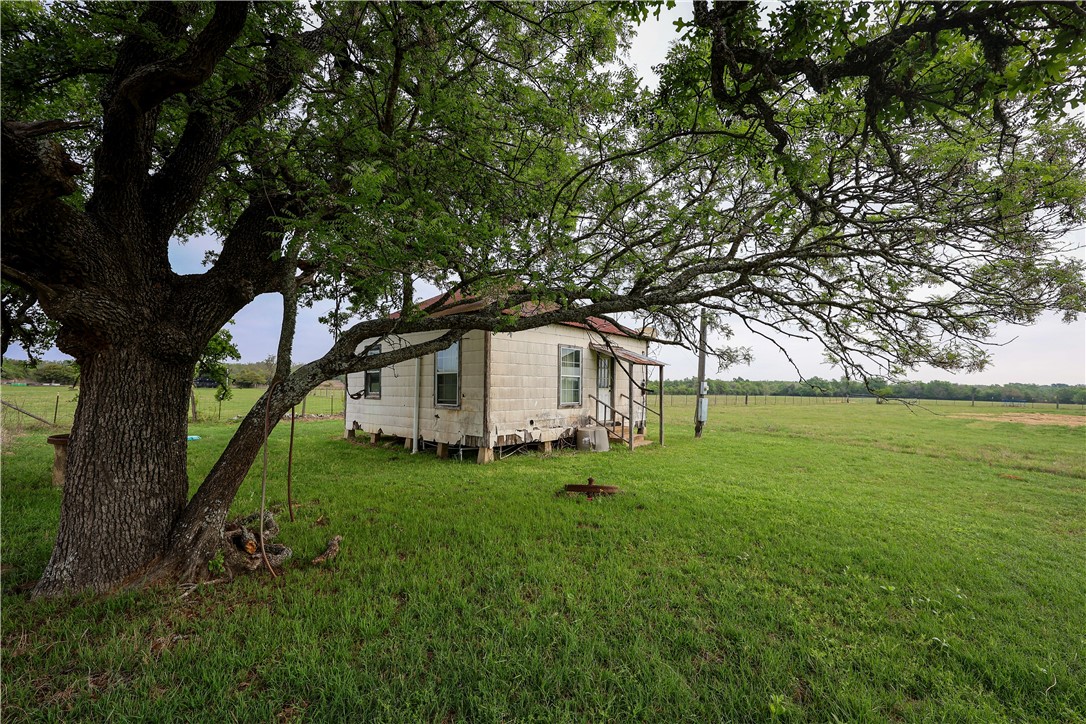 930 County Road 357 Gause, TX 77857 - Photo 17 of 17 a white house in middle of the forest