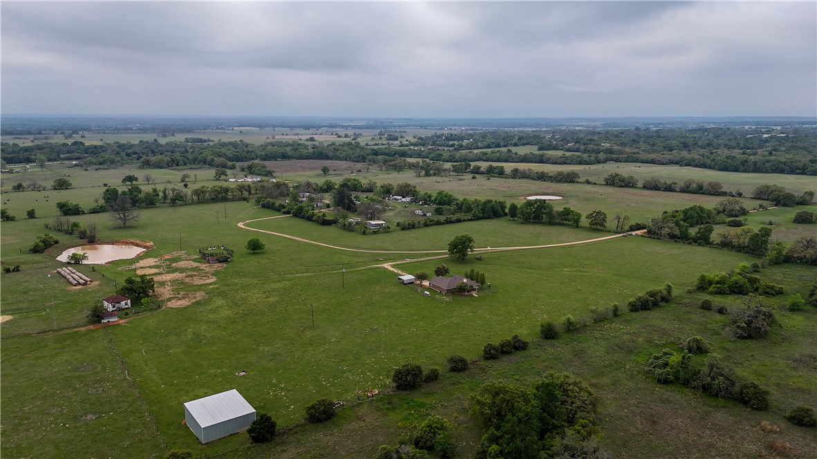 930 County Road 357 Gause, TX 77857 - Photo 9 of 17 an aerial view of a houses with outdoor space and trees