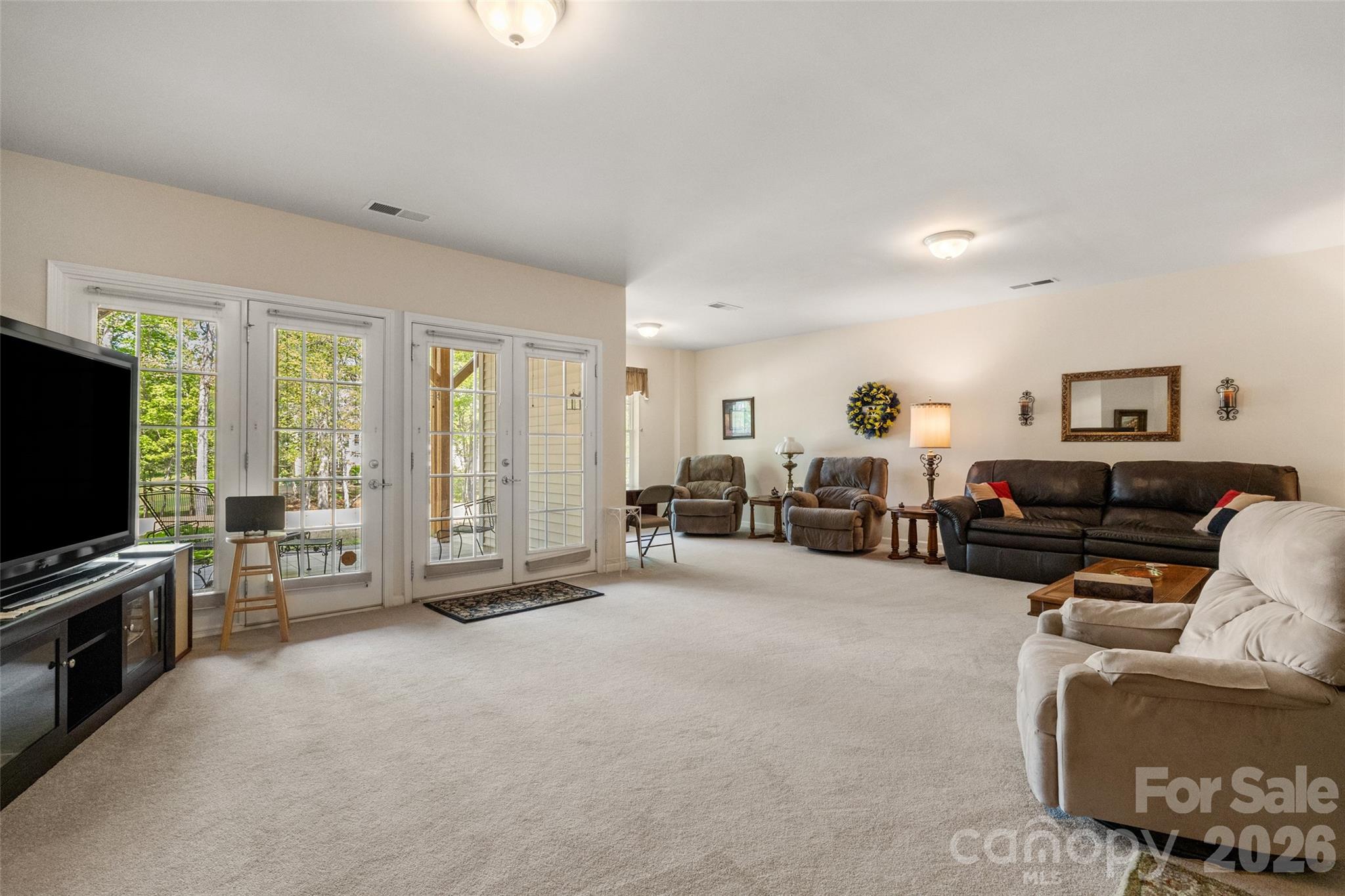27064 Sanderling Court Fort Mill, SC 29707 - Photo 28 of 48 a living room with furniture and a flat screen tv