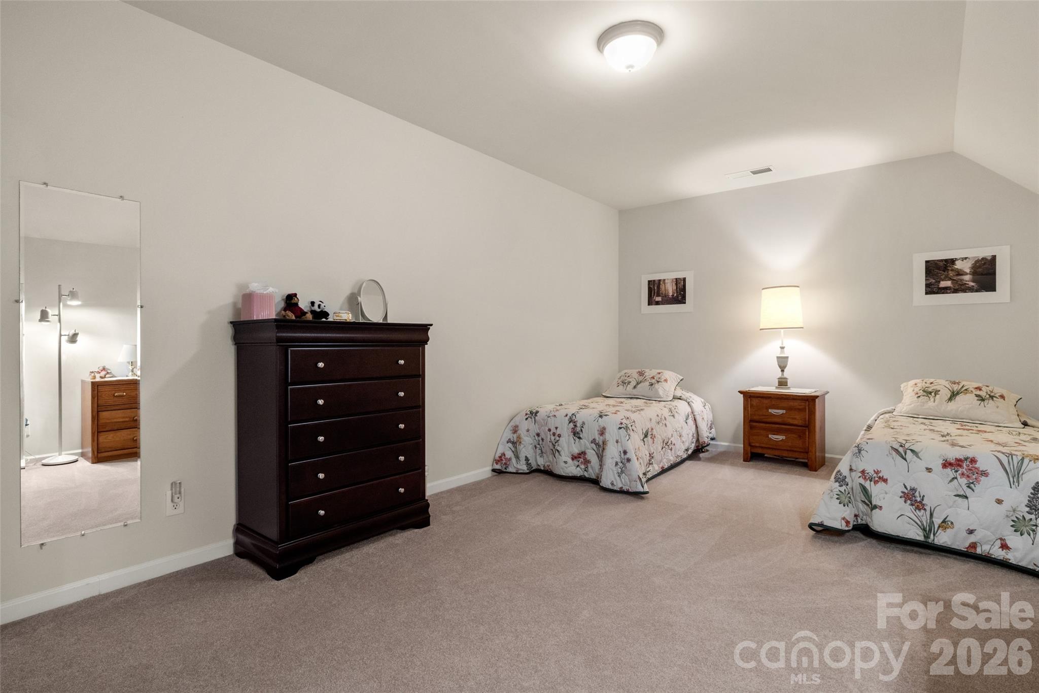 27064 Sanderling Court Fort Mill, SC 29707 - Photo 31 of 48 a bedroom with two bed and a lamp on dresser