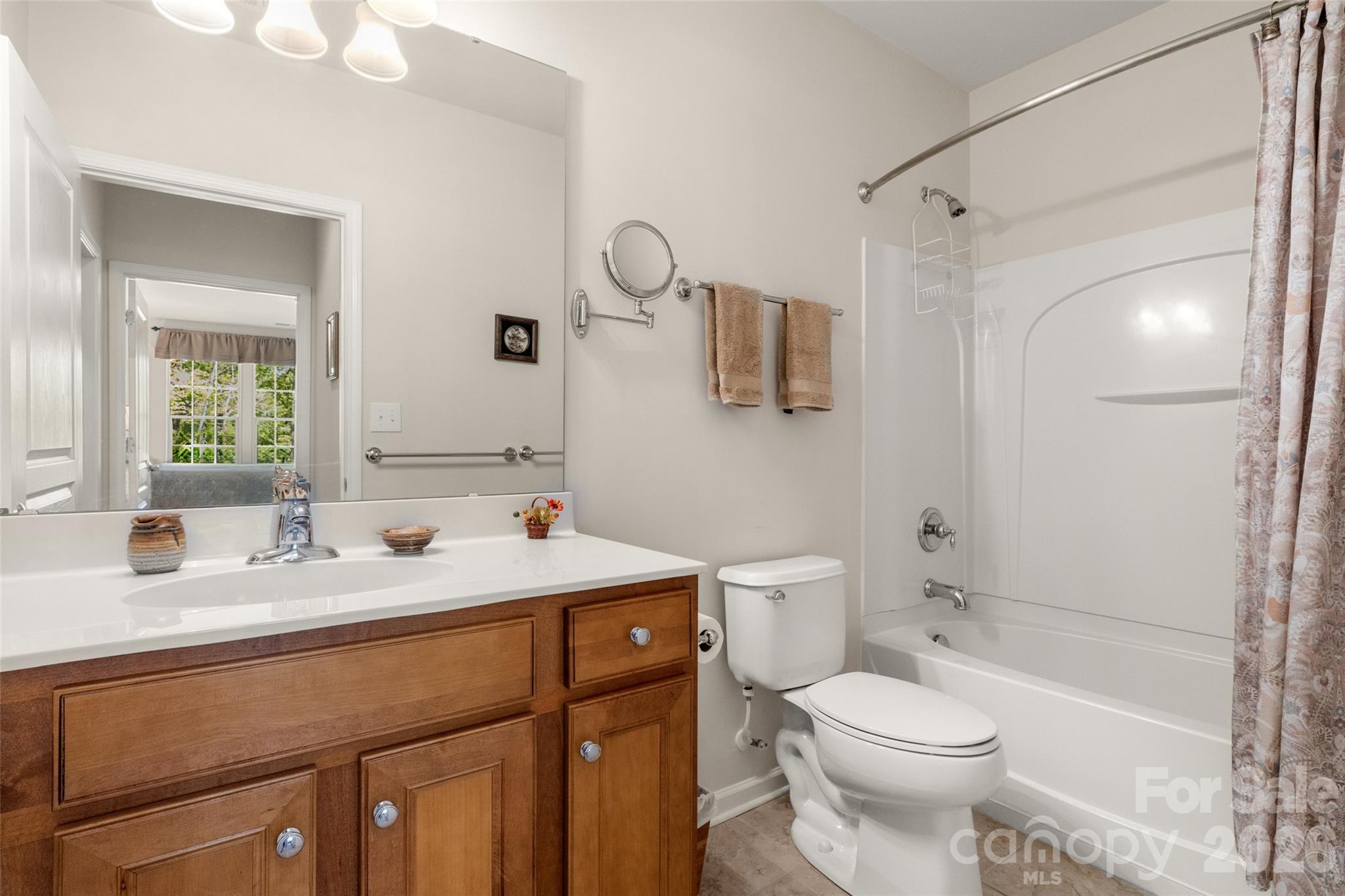 27064 Sanderling Court Fort Mill, SC 29707 - Photo 33 of 48 a bathroom with a sink toilet vanity and shower
