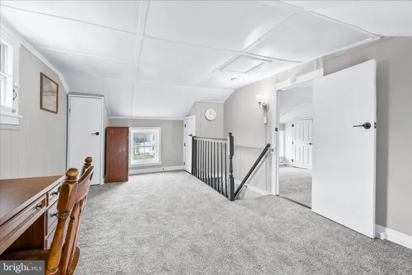 a view of an empty room with stairs