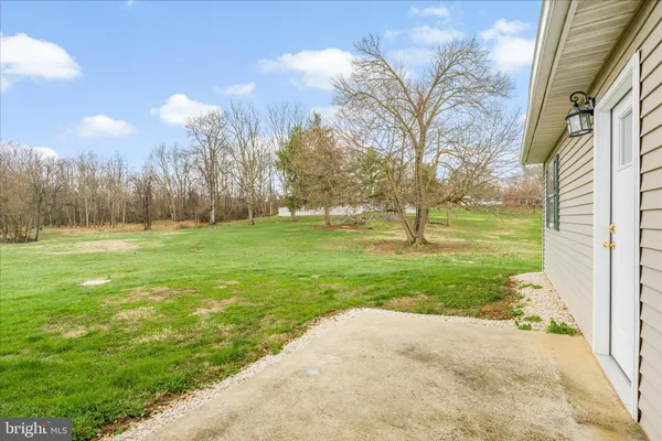 a view of an house with backyard and kitchen