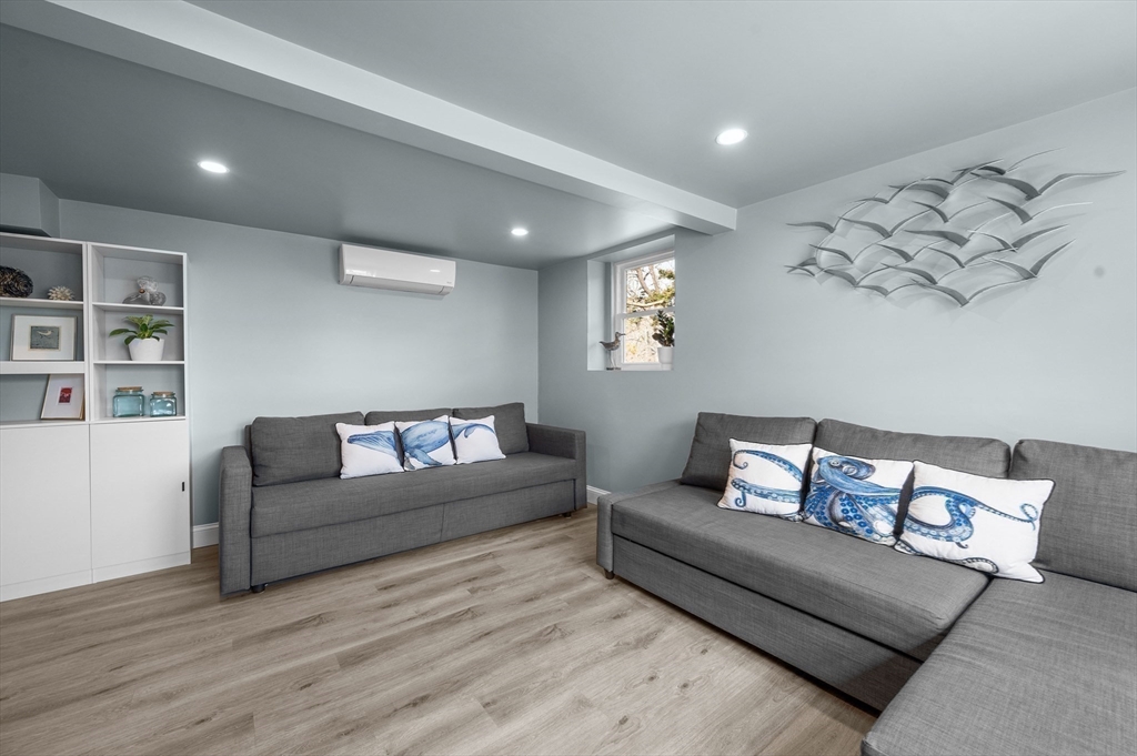 315 R Nauset Light Beach Road Eastham, MA 02642 - Photo 13 of 28 a living room with furniture and painting on the wall
